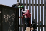 entering US via mexico, entering US via mexico, video clip shows punjabi women children crossing border fence into u s, Mexico border