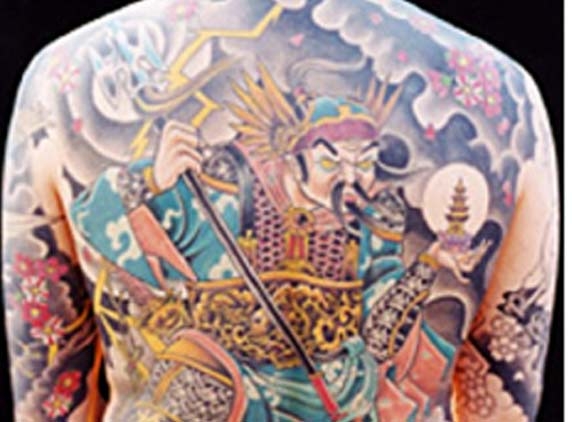 Court stunned by defendant who stripped to his waist to show tattoos all over body...